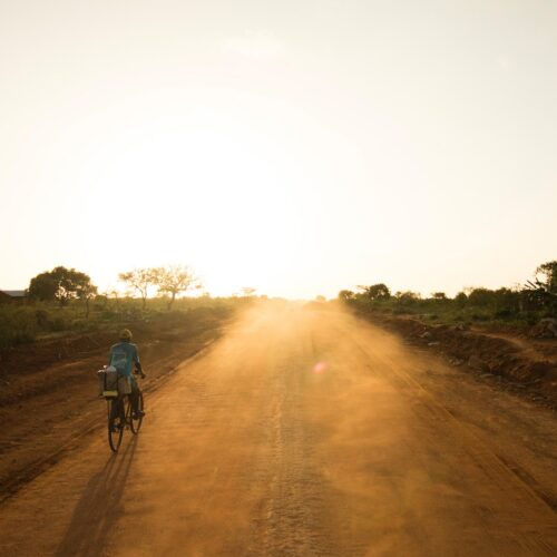 person riding bicycle on rod